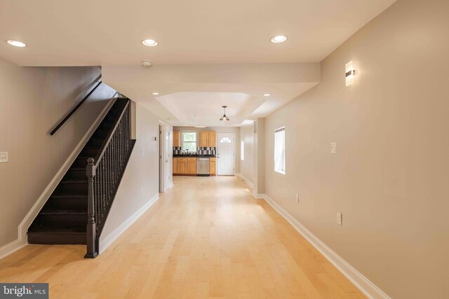 hall with light wood-type flooring