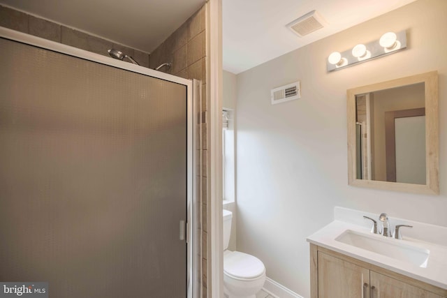 bathroom with walk in shower, vanity, and toilet