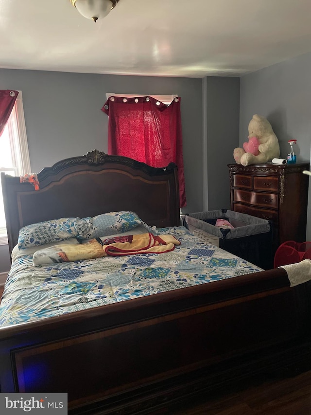 bedroom with hardwood / wood-style floors