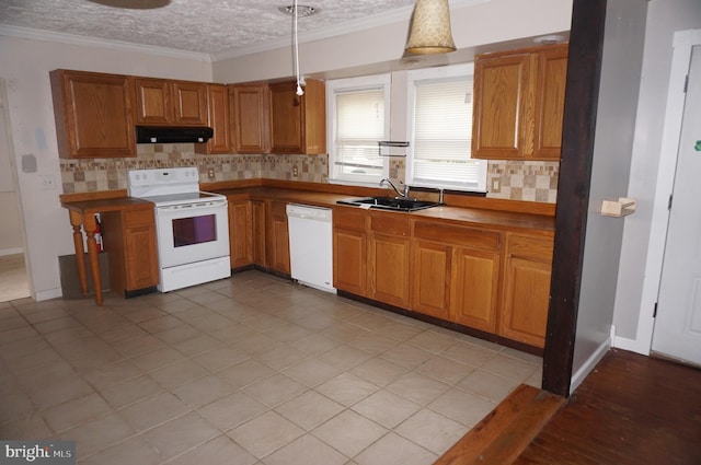 kitchen featuring white appliances, light tile patterned floors, pendant lighting, exhaust hood, and sink