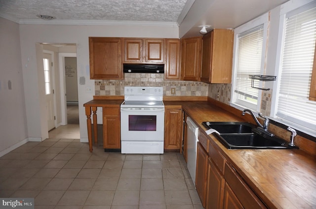 kitchen with sink, wooden counters, white appliances, a textured ceiling, and crown molding