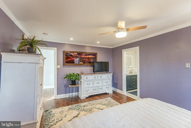 bedroom with ornamental molding, ensuite bath, wood-type flooring, and ceiling fan