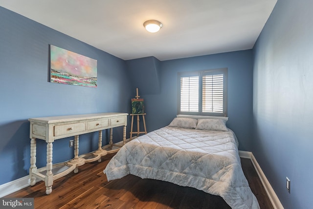 bedroom featuring dark wood-type flooring