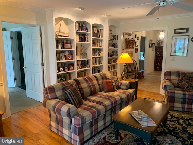 living room featuring ceiling fan, light hardwood / wood-style flooring, and ornamental molding