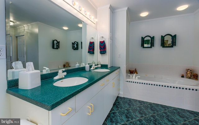 bathroom featuring ornamental molding, tile patterned floors, tiled bath, and vanity