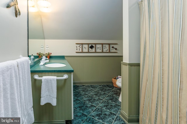 bathroom featuring tile patterned floors, vanity, and toilet