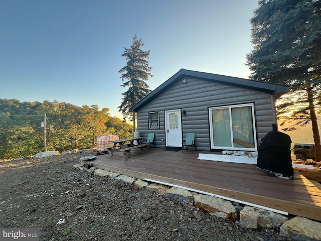 1604 High Knob Rd, Old Fields, WV 26845 - back of property at dusk featuring a wooden deck