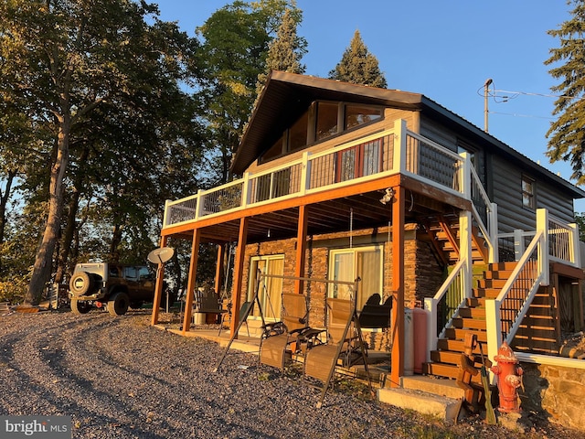 1604 High Knob Rd, Old Fields, WV 26845 - back of house featuring a deck, stairway, stone siding, and a patio area