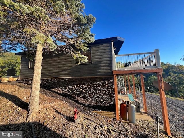 1604 High Knob Rd, Old Fields, WV 26845 - view of side of home with log veneer siding and a deck