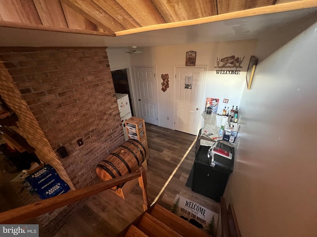 1604 High Knob Rd, Old Fields, WV 26845 - hall with dark wood-style flooring and brick wall