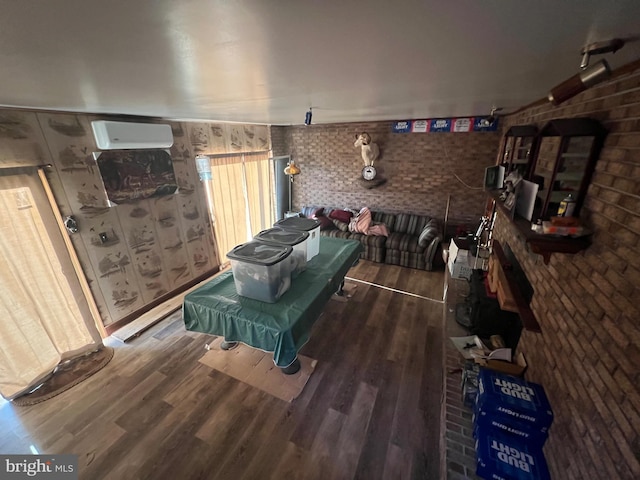1604 High Knob Rd, Old Fields, WV 26845 - living area with wood finished floors, brick wall, and track lighting