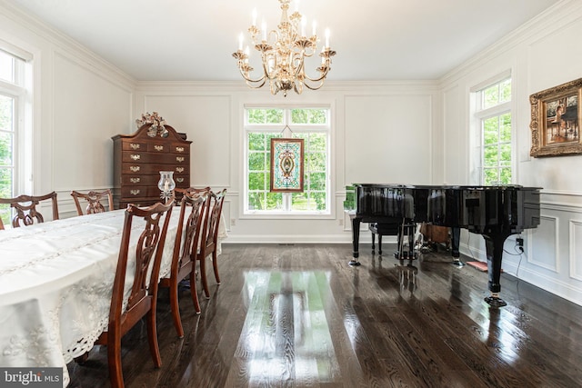 dining space featuring an inviting chandelier, dark hardwood / wood-style floors, crown molding, and a healthy amount of sunlight