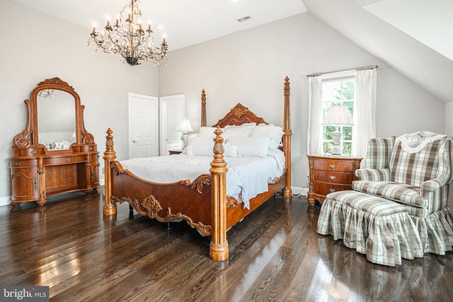 bedroom featuring an inviting chandelier, lofted ceiling, and dark hardwood / wood-style floors