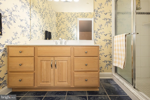 bathroom featuring vanity and an enclosed shower