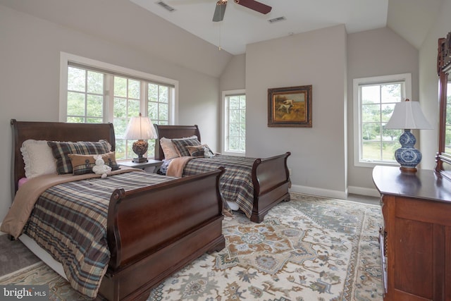 bedroom with multiple windows, lofted ceiling, and ceiling fan