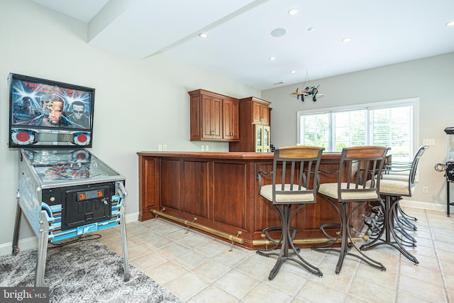 bar featuring light tile patterned floors