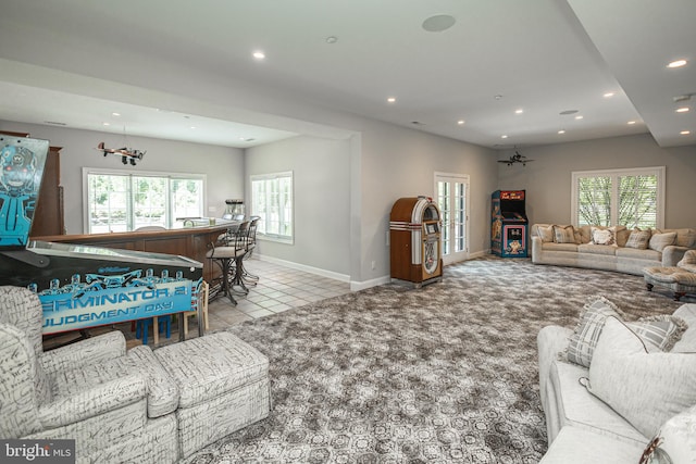 carpeted living room featuring indoor bar