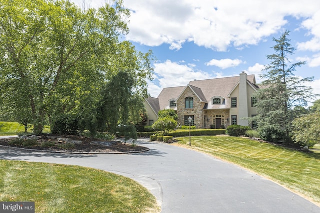 view of front of property with a front lawn