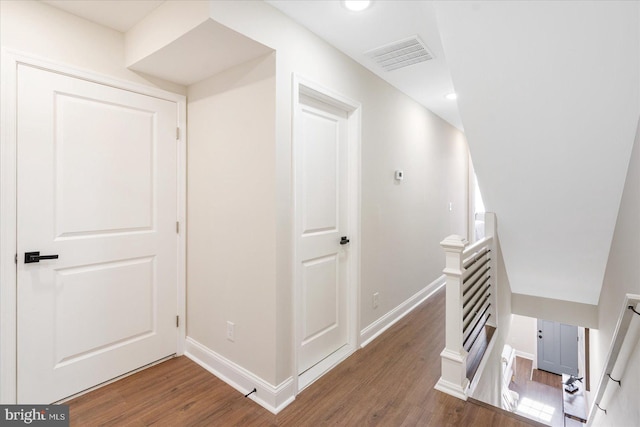 hallway featuring dark hardwood / wood-style flooring