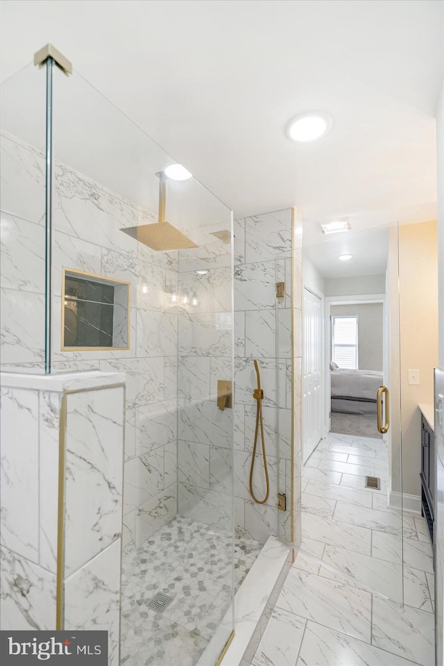 bathroom with walk in shower and vanity