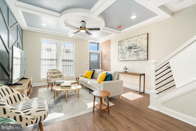 living room featuring coffered ceiling, hardwood / wood-style floors, and ceiling fan