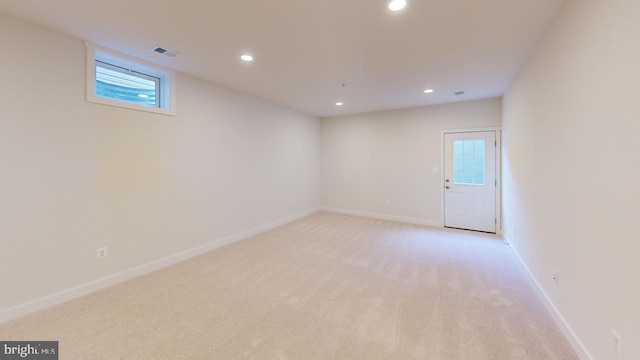 spare room with light carpet