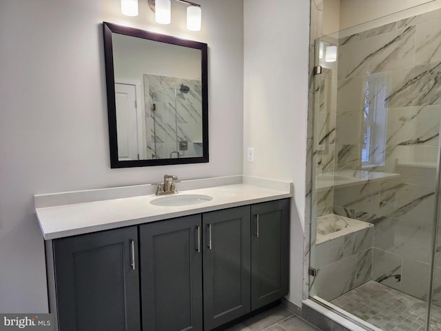 bathroom with an enclosed shower and vanity