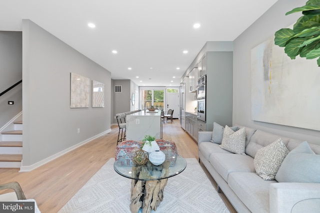 living room with light hardwood / wood-style floors