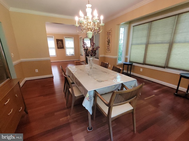 dining room featuring ornamental molding, a notable chandelier, and dark hardwood / wood-style flooring