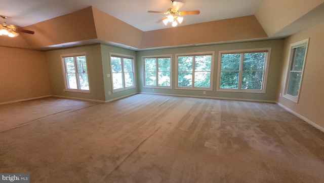 unfurnished living room with light carpet, vaulted ceiling, and ceiling fan