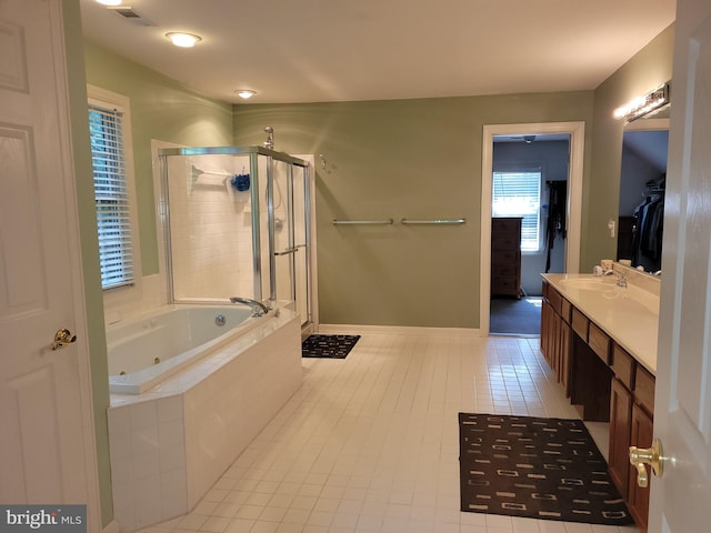 bathroom with vanity, shower with separate bathtub, and tile patterned flooring