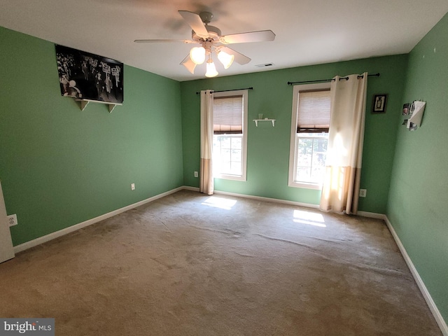 unfurnished room featuring carpet floors and ceiling fan