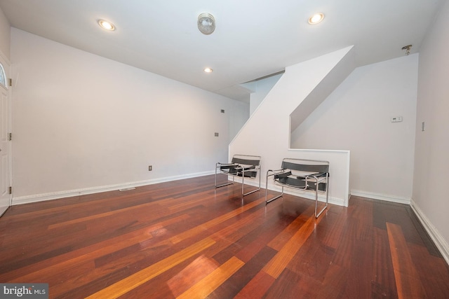 bonus room with dark hardwood / wood-style flooring