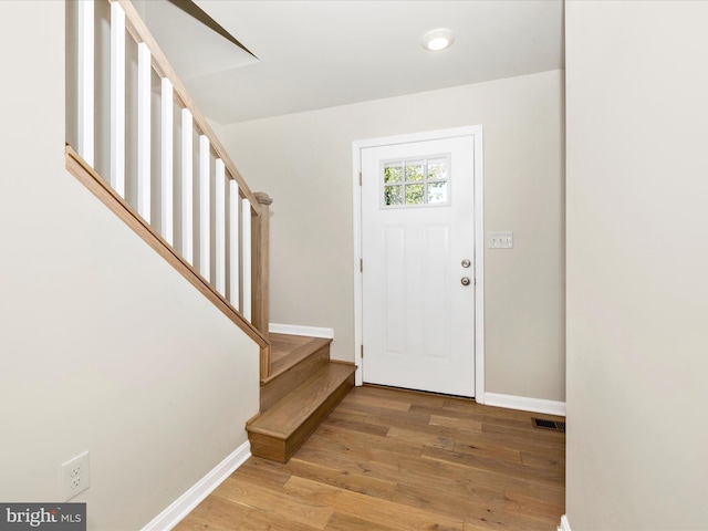 foyer entrance featuring hardwood / wood-style floors