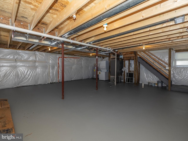 basement with electric water heater and heating unit