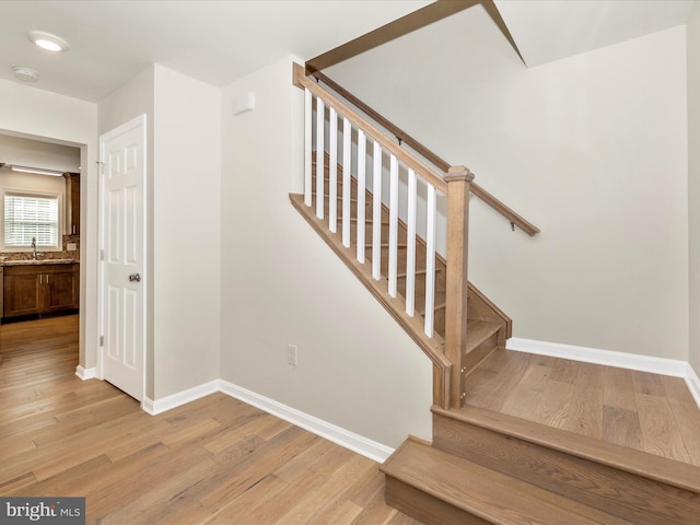 stairway with wood-type flooring