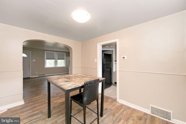 dining area with hardwood / wood-style flooring