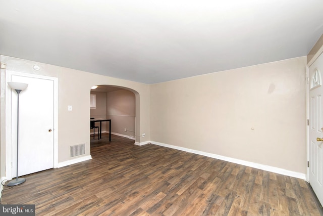 spare room featuring dark hardwood / wood-style flooring