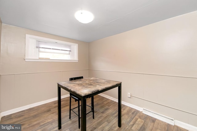 office with a baseboard radiator and hardwood / wood-style flooring