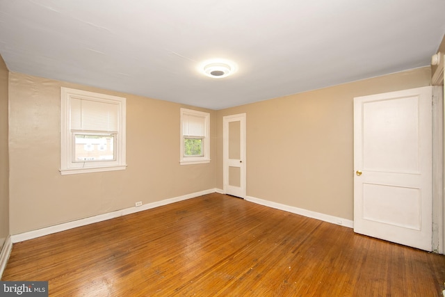 empty room featuring hardwood / wood-style floors