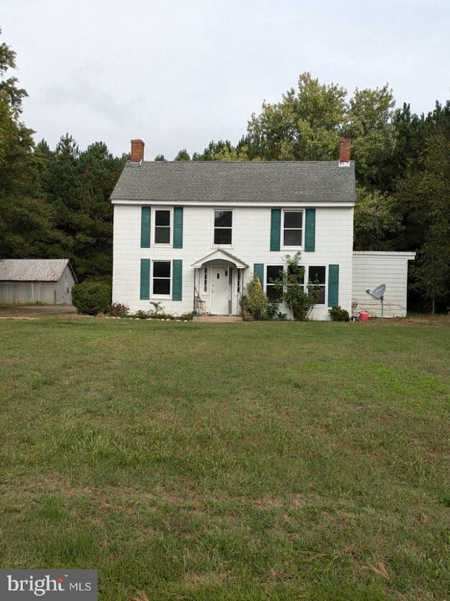 view of front of house with a front lawn