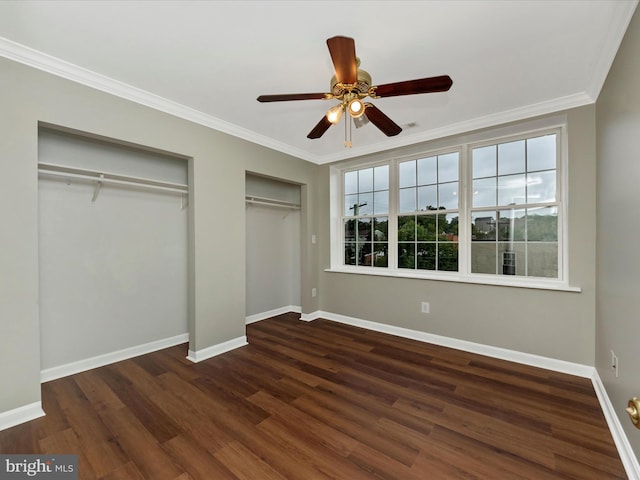 unfurnished bedroom featuring ornamental molding, dark hardwood / wood-style floors, and ceiling fan