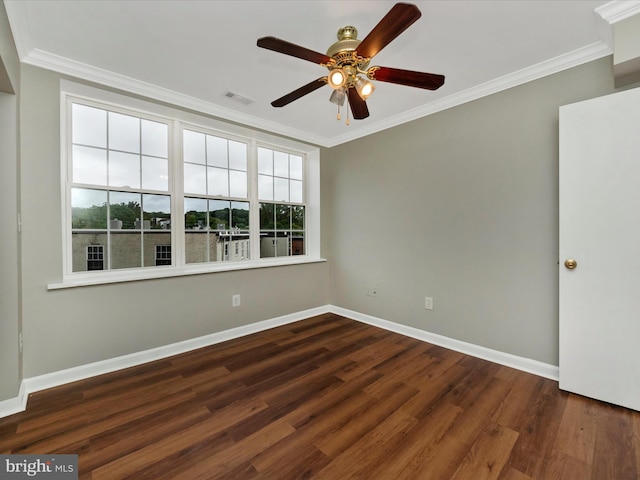 unfurnished room featuring ceiling fan, ornamental molding, and dark hardwood / wood-style floors