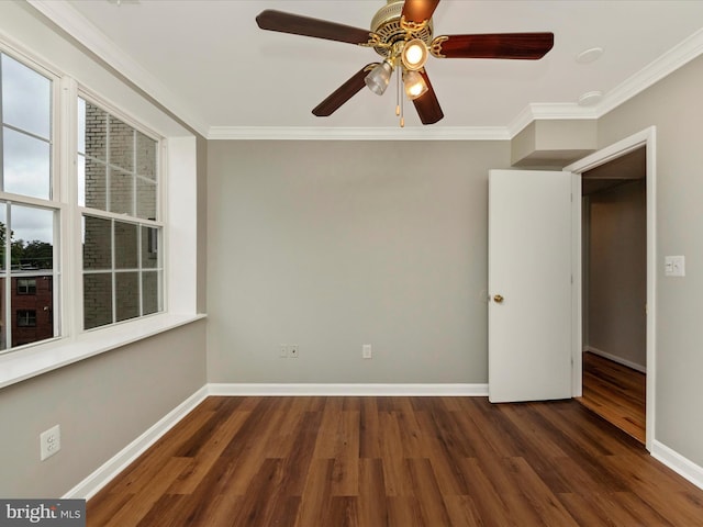 unfurnished room featuring ceiling fan, ornamental molding, and dark hardwood / wood-style floors