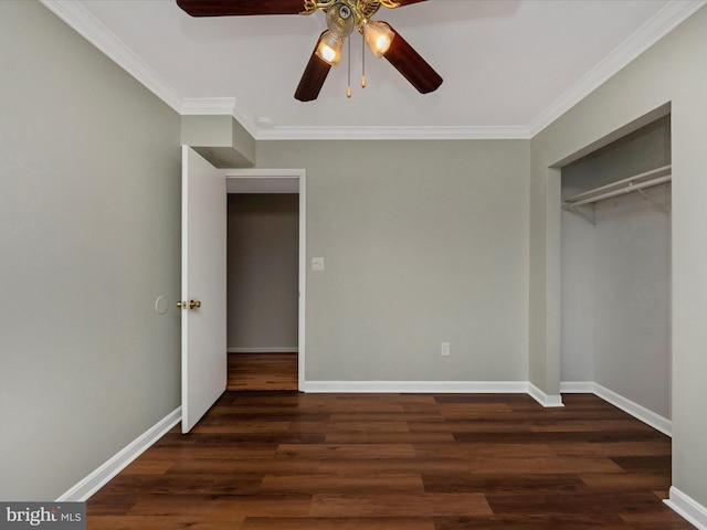 unfurnished bedroom featuring ornamental molding, dark hardwood / wood-style floors, a closet, and ceiling fan