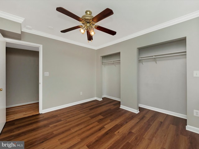 unfurnished bedroom with ceiling fan, ornamental molding, and dark hardwood / wood-style flooring