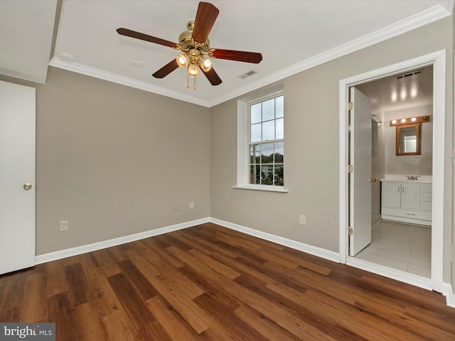 spare room with ceiling fan, wood-type flooring, and ornamental molding