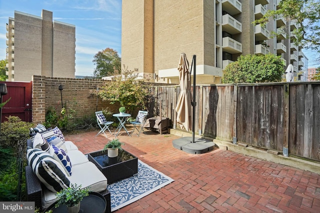 view of patio / terrace with a balcony