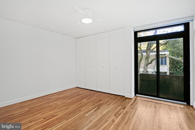 unfurnished bedroom featuring light wood-type flooring, a closet, and ceiling fan