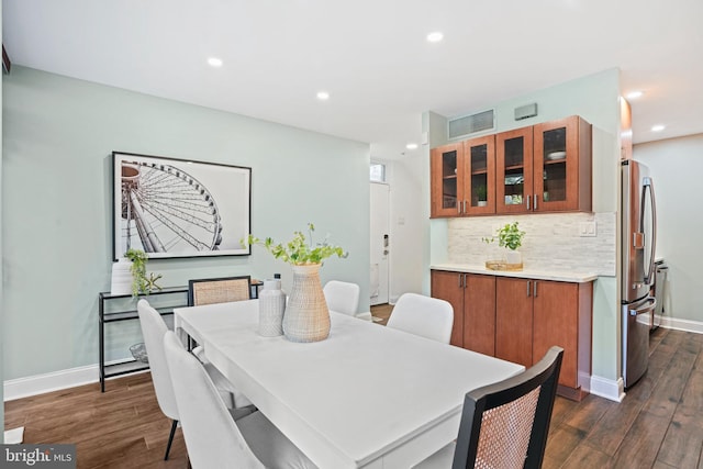 dining space featuring dark hardwood / wood-style floors